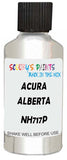 Detail brush applying White Metallic to a small door scratch on an Acura Rl, clean OEM finish