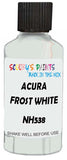 Detail brush applying White Solid to a small door scratch on an Acura Integra, clean OEM finish