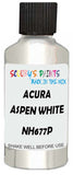 Detail brush applying White Metallic to a small door scratch on an Acura Mdx, clean OEM finish