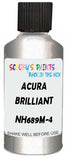 Detail brush applying Silver Metallic to a small door scratch on an Acura Mdx, clean OEM finish