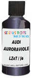 Detail brush applying Purple Metallic to a small door scratch on an Audi Q4, clean OEM finish