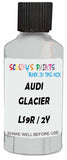 Detail brush applying White Metallic to a small door scratch on an Audi Allroad, clean OEM finish