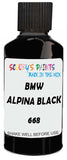 Detail brush applying Black Solid to a small door scratch on an Bmw Alpina, clean OEM finish