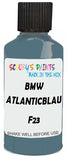 Detail brush applying Blue Solid to a small door scratch on an Bmw 6-Series Coupe, clean OEM finish