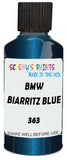 Detail brush applying Blue Metallic to a small door scratch on an Bmw 7-Series, clean OEM finish