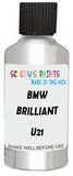 Detail brush applying White Metallic to a small door scratch on an Bmw 8-Series Gran Coupe, clean OEM finish
