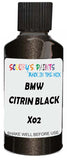 Detail brush applying Black Metallic to a small door scratch on an Bmw 6-Series Gran Coupe, clean OEM finish