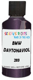 Detail brush applying Purple-Violet Metallic to a small door scratch on an Bmw M4, clean OEM finish