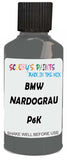 Detail brush applying Grey Solid to a small door scratch on an Bmw 7-Series, clean OEM finish