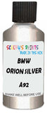 Detail brush applying Silver Metallic to a small door scratch on an Bmw 6-Series Cabrio, clean OEM finish
