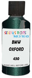 Detail brush applying Green Metallic to a small door scratch on an Bmw M3, clean OEM finish