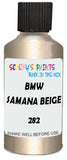 Detail brush applying Beige Metallic to a small door scratch on an Bmw 7-Series, clean OEM finish