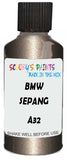 Detail brush applying Gold Metallic to a small door scratch on an Bmw 7-Series, clean OEM finish