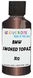 Detail brush applying Brown Metallic to a small door scratch on an Bmw M3, clean OEM finish