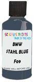 Detail brush applying Blue Solid to a small door scratch on an Bmw 5-Series Touring, clean OEM finish