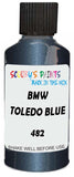 Detail brush applying Blue Metallic to a small door scratch on an Bmw 5-Series, clean OEM finish