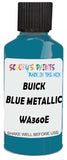 Detail brush applying Blue Solid to a small door scratch on an Buick Regal, clean OEM finish