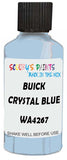 Detail brush applying Blue Solid to a small door scratch on an Buick Lesabre, clean OEM finish