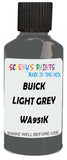 Detail brush applying Grey Solid to a small door scratch on an Buick Rainier, clean OEM finish