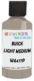 Detail brush applying Beige Solid to a small door scratch on an Buick Enclave, clean OEM finish