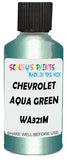 Detail brush applying Green Metallic to a small door scratch on an Chevrolet Aveo, clean OEM finish