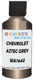 Detail brush applying Grey Metallic to a small door scratch on an Chevrolet Tornado, clean OEM finish