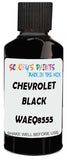 Detail brush applying Black Solid to a small door scratch on an Chevrolet Tahoe, clean OEM finish