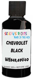 Detail brush applying Black Solid to a small door scratch on an Chevrolet Trucks, clean OEM finish