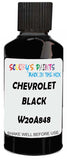 Detail brush applying Black Solid to a small door scratch on an Chevrolet Corvette, clean OEM finish