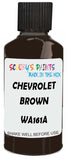 Detail brush applying Brown Solid to a small door scratch on an Chevrolet Blazer, clean OEM finish