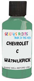 Detail brush applying Green Solid to a small door scratch on an Chevrolet C/K Pickup, clean OEM finish