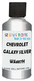 Detail brush applying Silver Metallic to a small door scratch on an Chevrolet Tracker, clean OEM finish