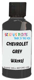 Detail brush applying Grey Solid to a small door scratch on an Chevrolet Blazer, clean OEM finish