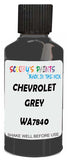 Detail brush applying Grey Solid to a small door scratch on an Chevrolet Tahoe, clean OEM finish