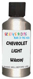Detail brush applying Gold Metallic to a small door scratch on an Chevrolet Tracker, clean OEM finish