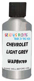 Detail brush applying Grey Metallic to a small door scratch on an Chevrolet Trailblazer, clean OEM finish