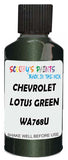 Detail brush applying Green Metallic to a small door scratch on an Chevrolet Tornado, clean OEM finish