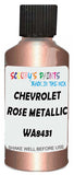 Detail brush applying Pink Metallic to a small door scratch on an Chevrolet Tahoe, clean OEM finish