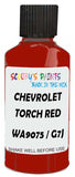 Detail brush applying Red Solid to a small door scratch on an Chevrolet Ssr, clean OEM finish