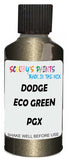 Detail brush applying Green Metallic to a small door scratch on an Dodge Ram, clean OEM finish