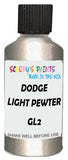 Detail brush applying White Metallic to a small door scratch on an Dodge Trucks, clean OEM finish