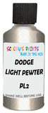 Detail brush applying White Metallic to a small door scratch on an Dodge Trucks, clean OEM finish