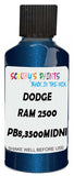 Detail brush applying Blue Metallic to a small door scratch on an Dodge Ram 2500/3500, clean OEM finish