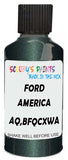 Detail brush applying Green Metallic to a small door scratch on an Ford F-150, clean OEM finish