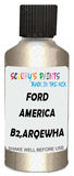 Detail brush applying Gold Metallic to a small door scratch on an Ford F-150, clean OEM finish