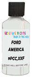 Detail brush applying White Solid to a small door scratch on an Ford F-150, clean OEM finish