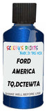 Detail brush applying Blue Metallic to a small door scratch on an Ford F-150, clean OEM finish