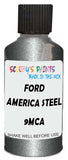 Detail brush applying Grey Metallic to a small door scratch on an Ford F-150, clean OEM finish