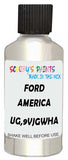 Detail brush applying White Metallic to a small door scratch on an Ford F-150, clean OEM finish