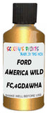 Detail brush applying Gold Metallic to a small door scratch on an Ford F-150, clean OEM finish